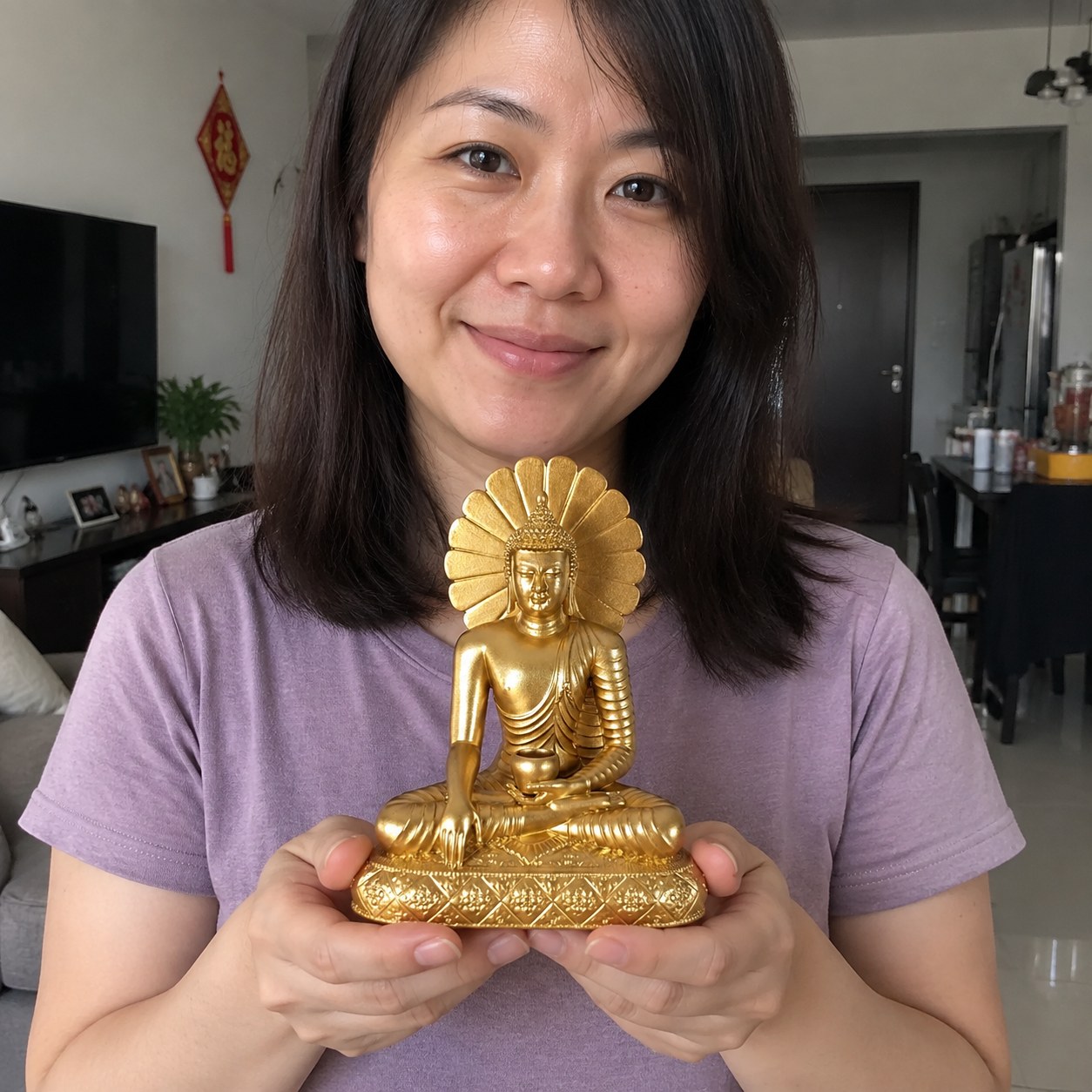 Sakyamuni Buddha 释迦牟尼佛 gold resin statue in a home